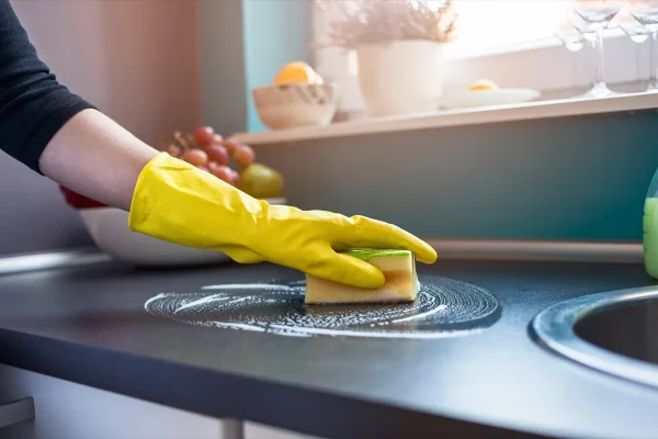 person-wearing-gloves-cleaning